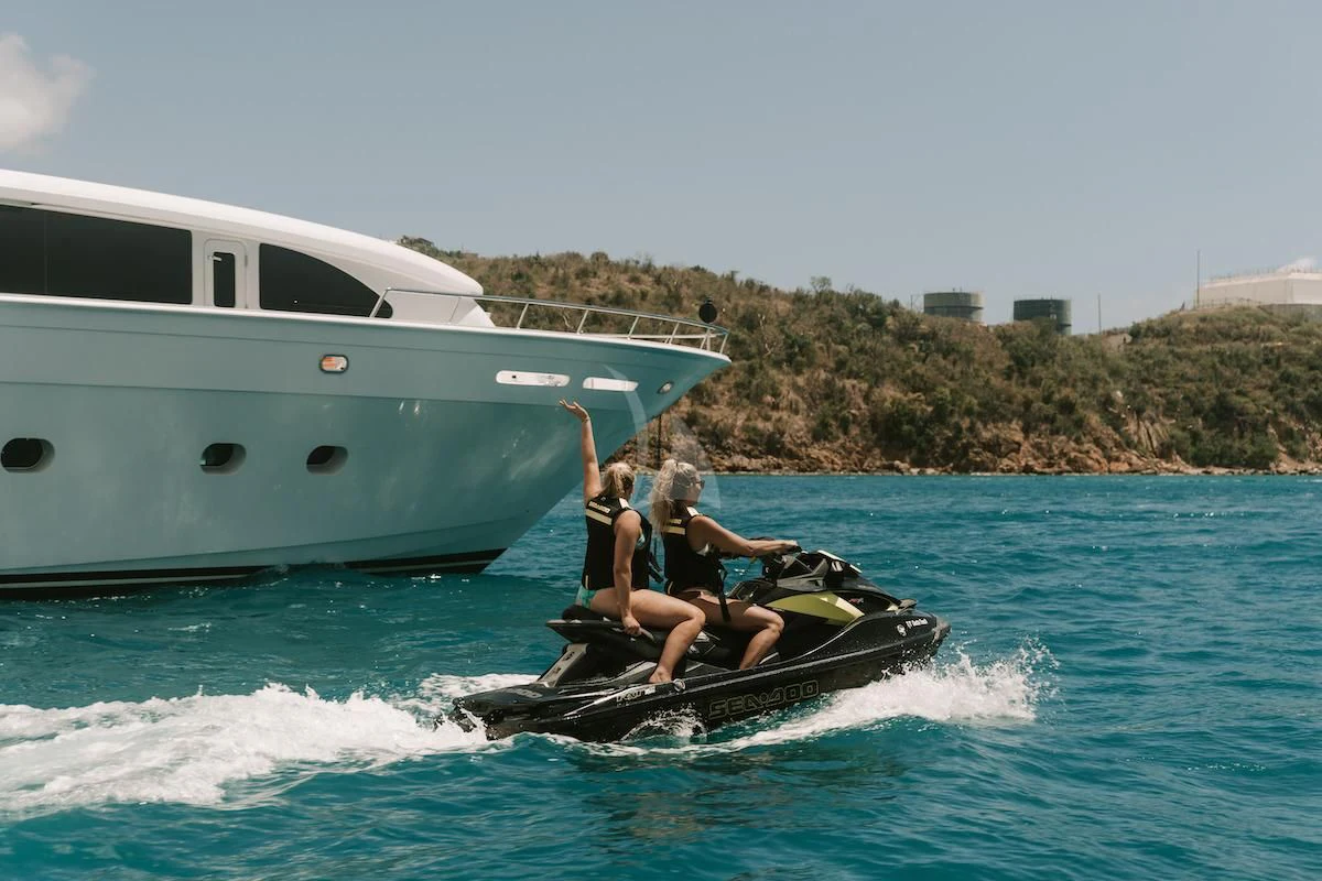 a man and woman on a boat aboard OUTTA TOUCH Yacht for Sale