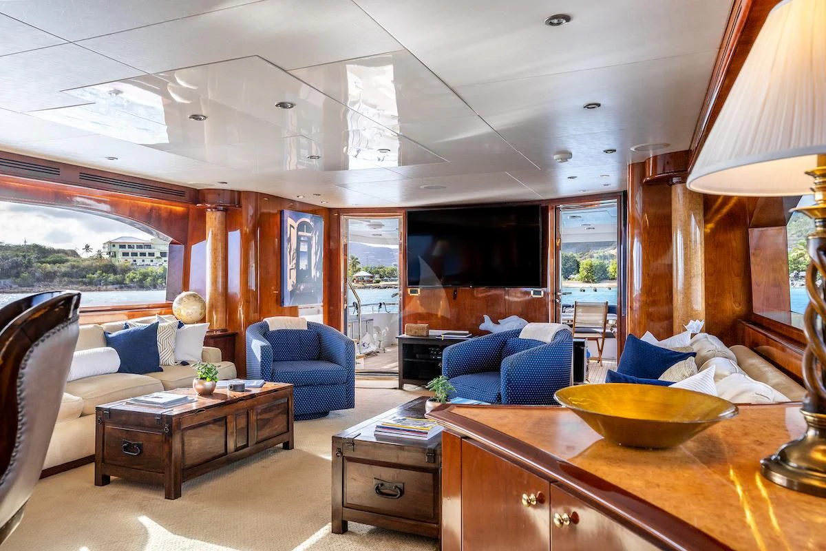 a living room with a fireplace aboard OUTTA TOUCH Yacht for Sale