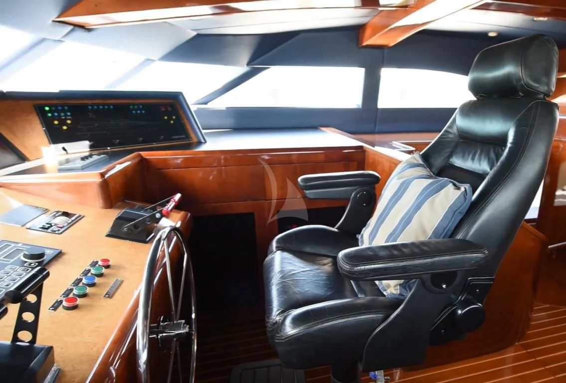 a room with a desk and chairs aboard OUTTA TOUCH Yacht for Sale