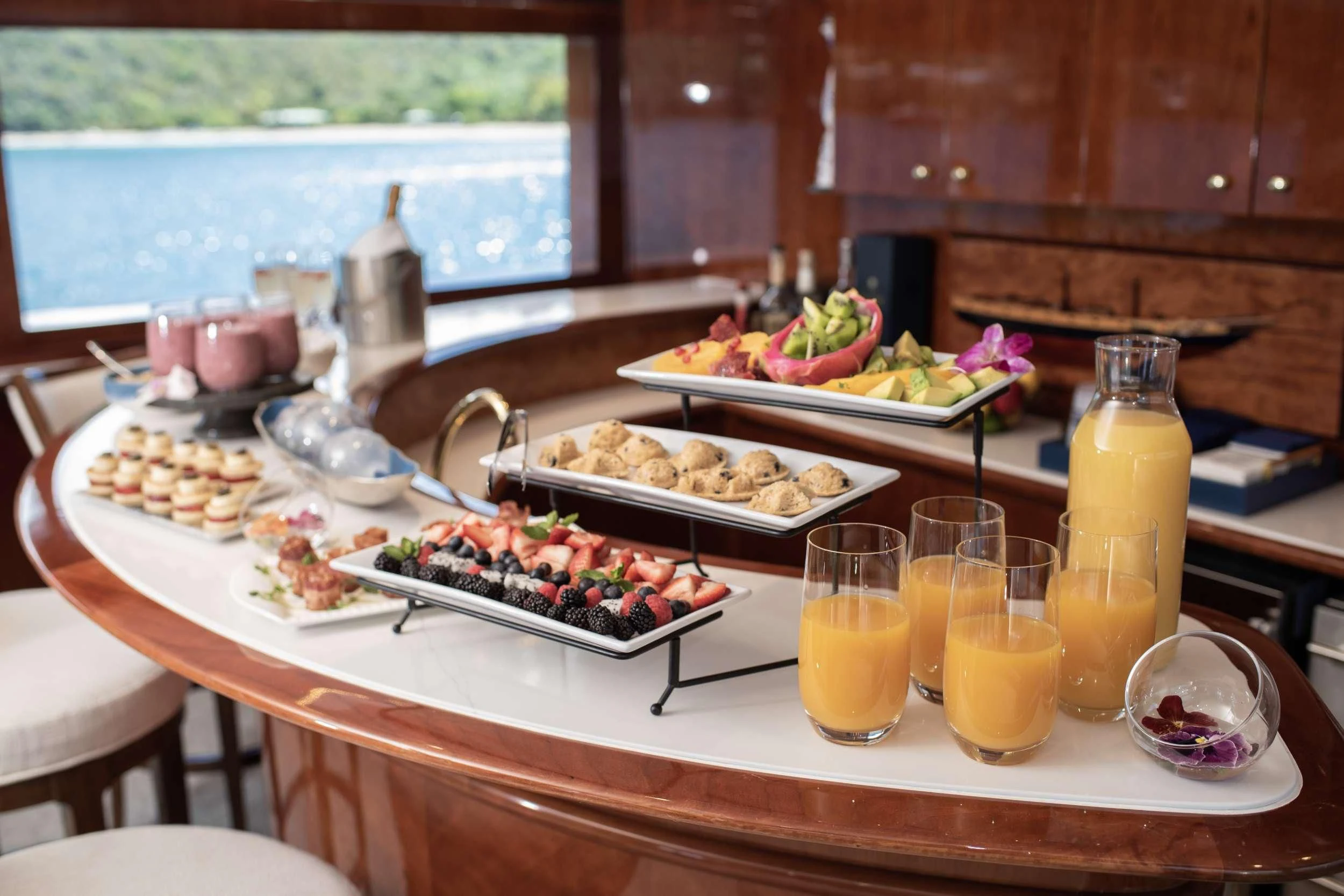 a table with food and drinks on it aboard OUTTA TOUCH Yacht for Sale