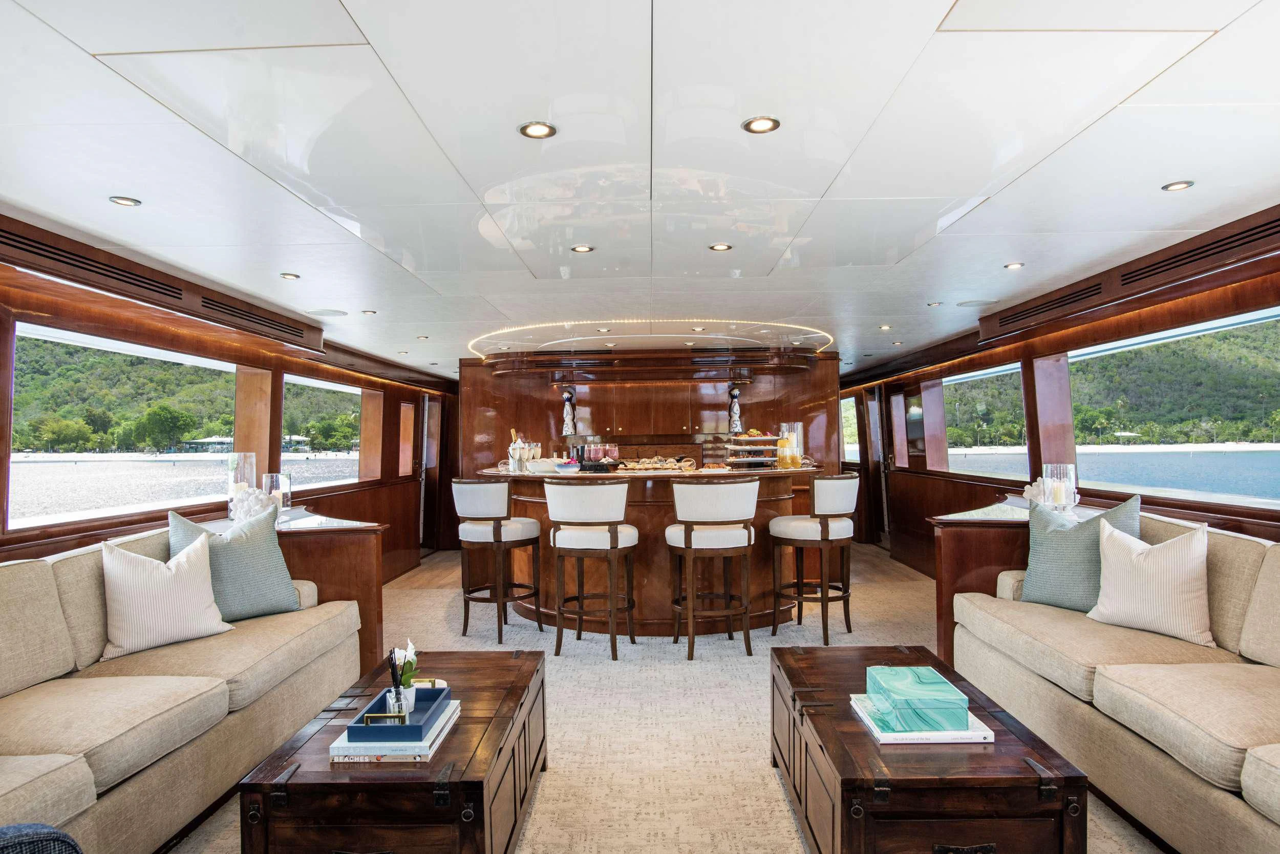 a living room with a table and couches aboard OUTTA TOUCH Yacht for Sale