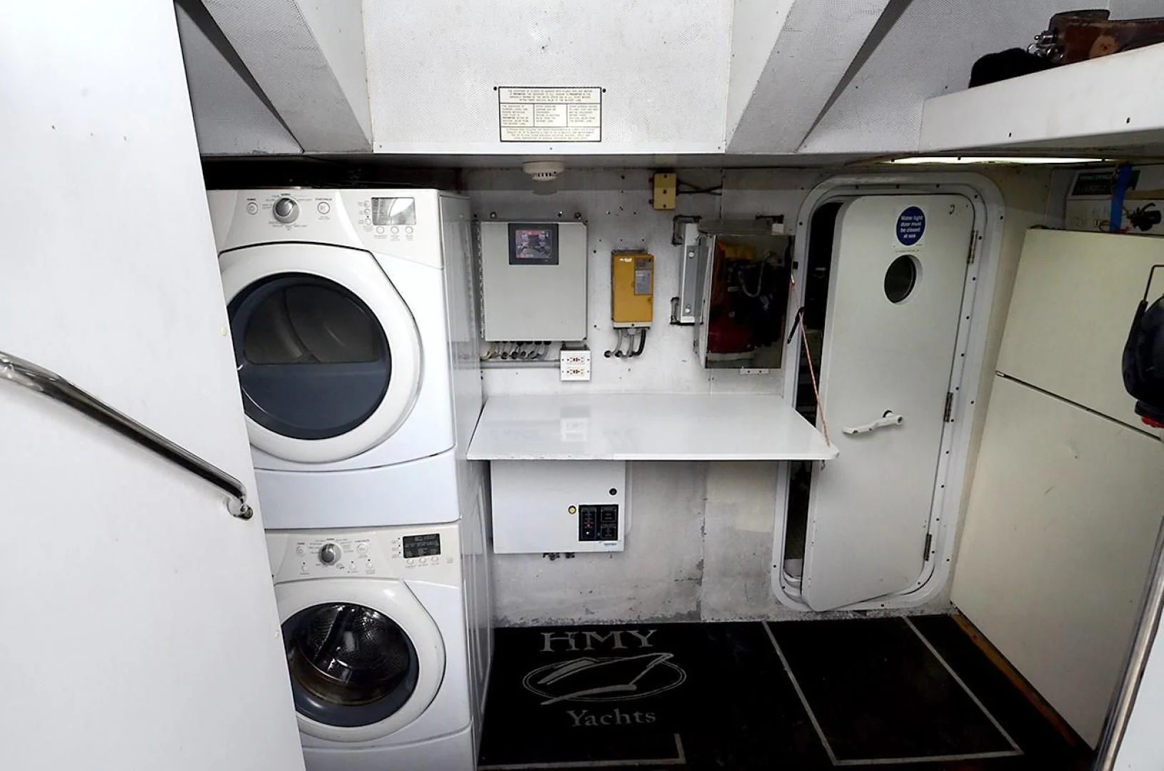 a white laundry room aboard OUTTA TOUCH Yacht for Sale
