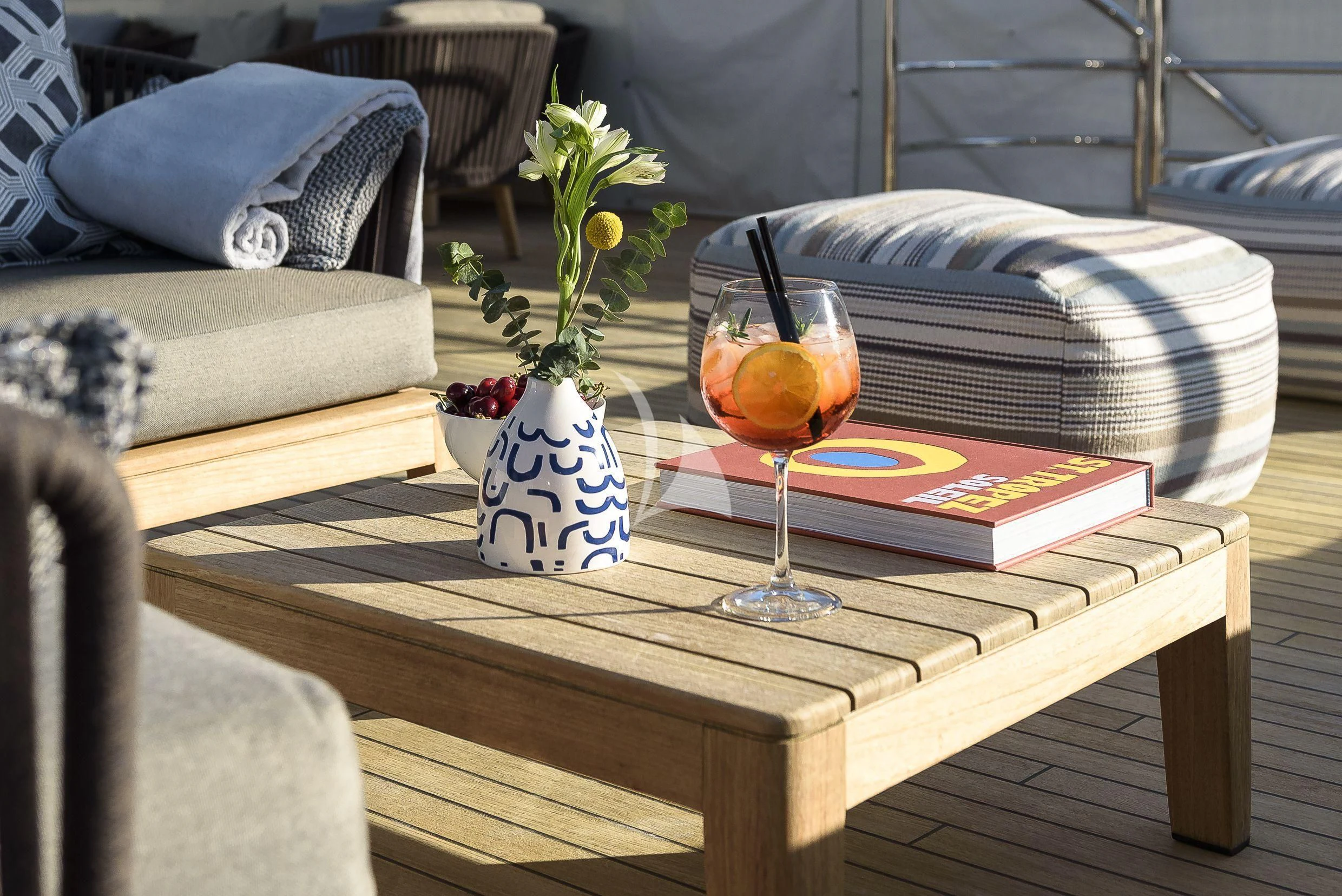 a glass of wine on a table aboard MR. T Yacht for Charter