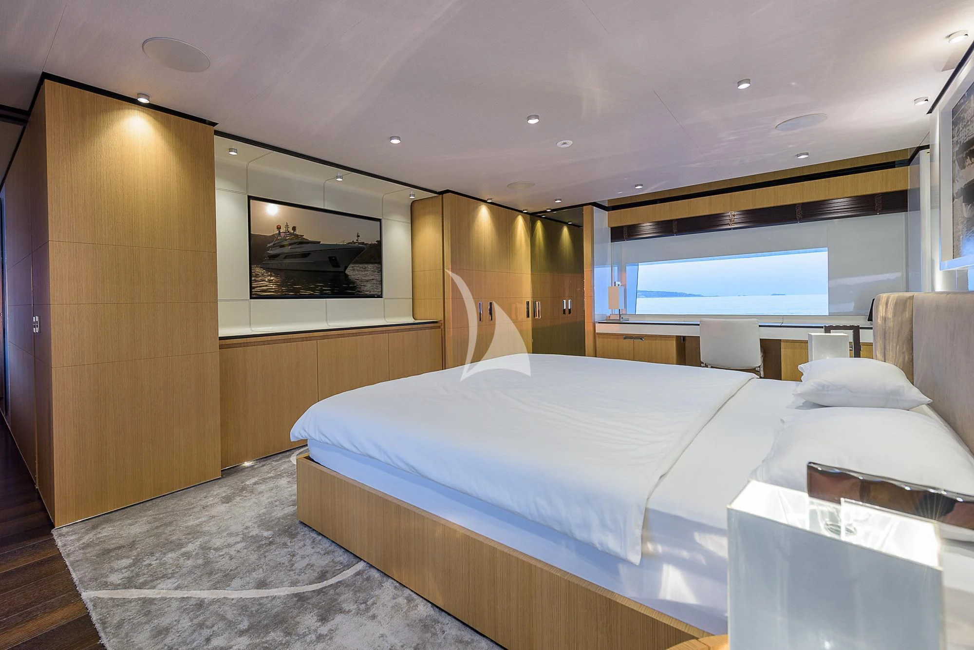 a room with a bed and a window aboard MR. T Yacht for Charter