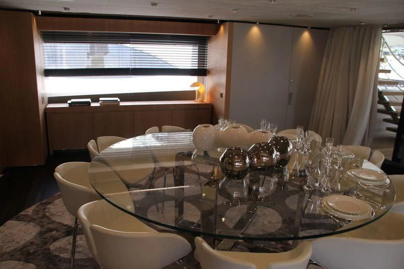 a table with wine glasses aboard MR. T Yacht for Charter