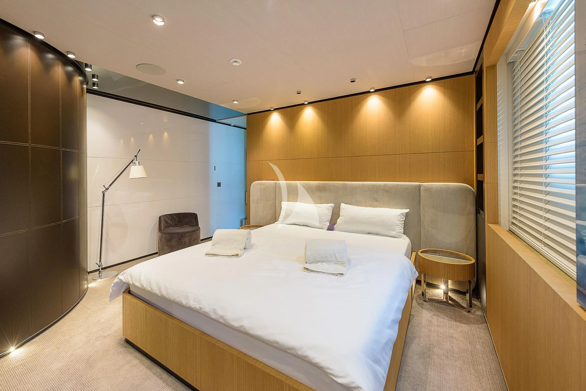 a bed in a room aboard MR. T Yacht for Charter