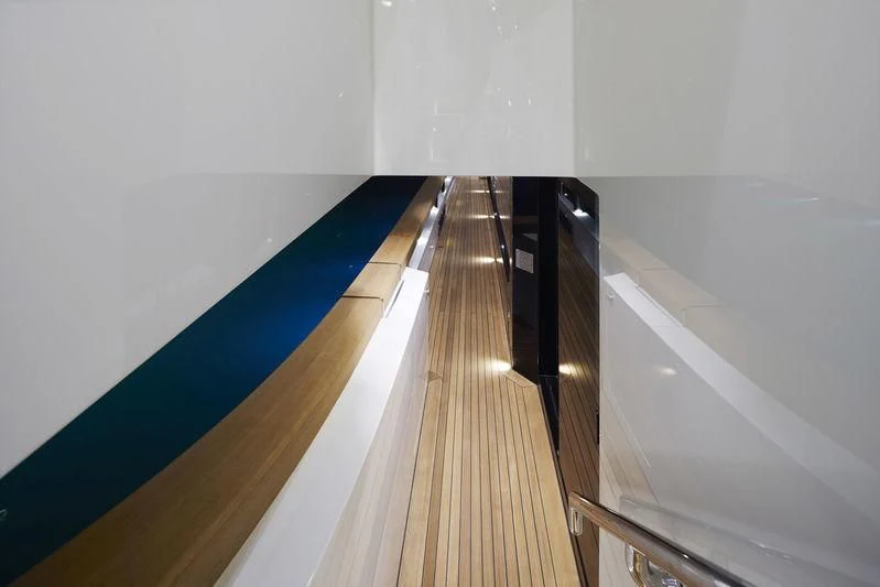 a long wooden staircase aboard MR. T Yacht for Charter