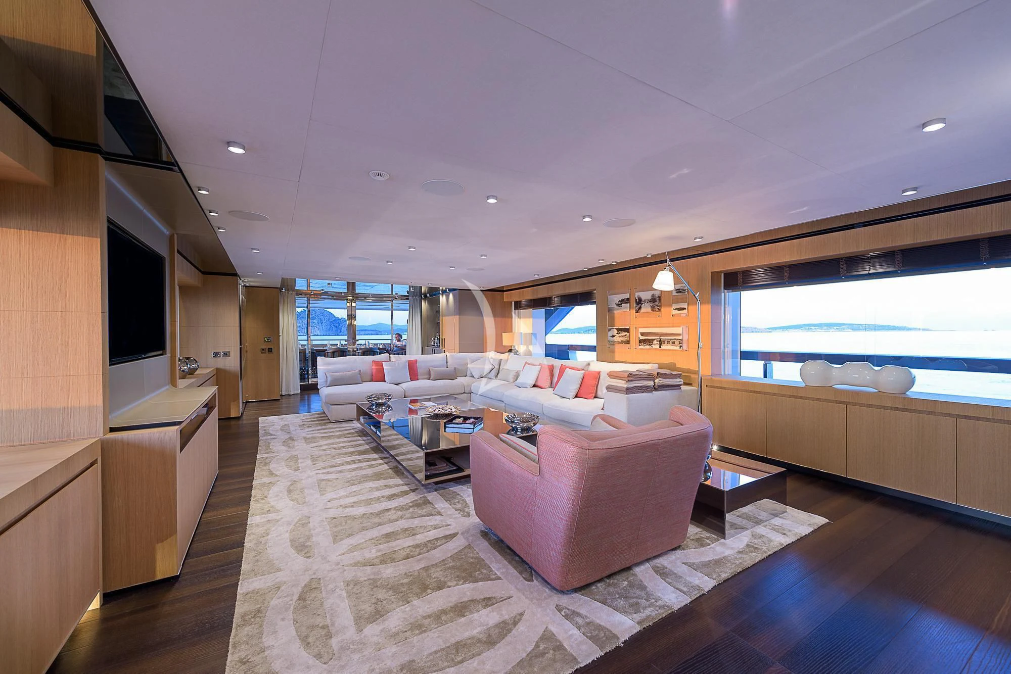 a large living room with a large window aboard MR. T Yacht for Charter
