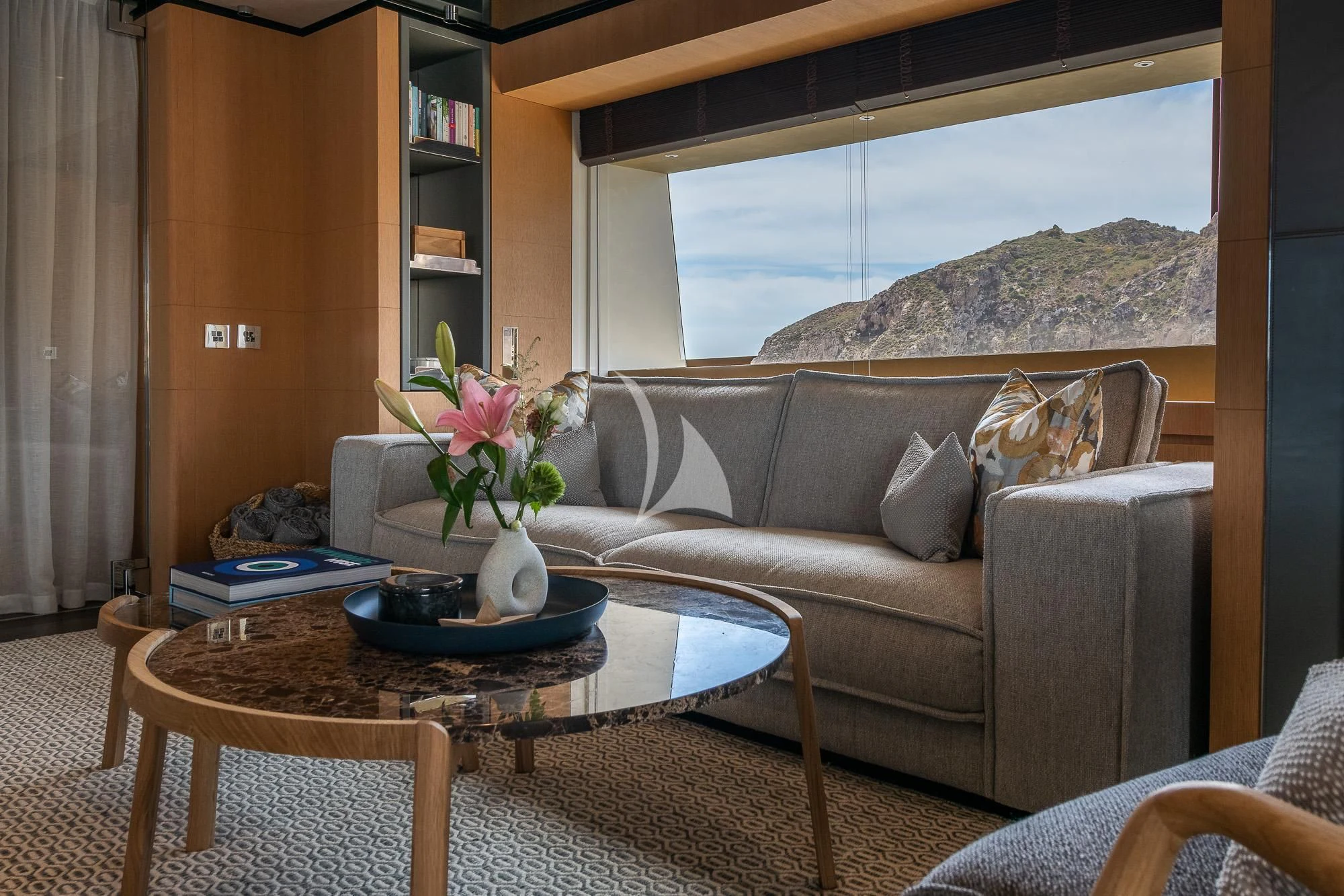 a living room with a couch and a coffee table aboard MR. T Yacht for Charter