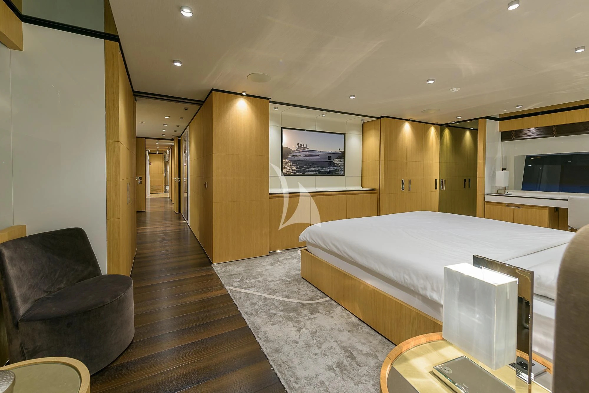 a bedroom with a bed and a couch aboard MR. T Yacht for Charter