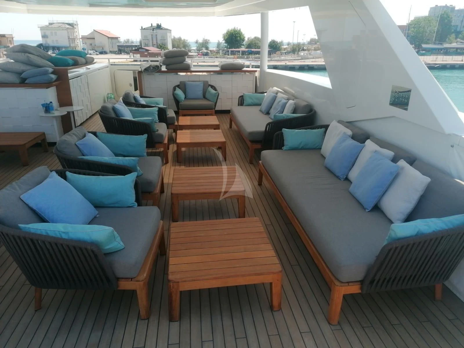 a room with a couch and a table and a bed aboard MR. T Yacht for Charter