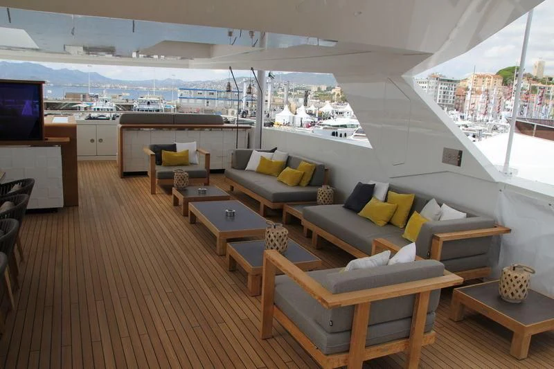 a living room with a large window aboard MR. T Yacht for Charter