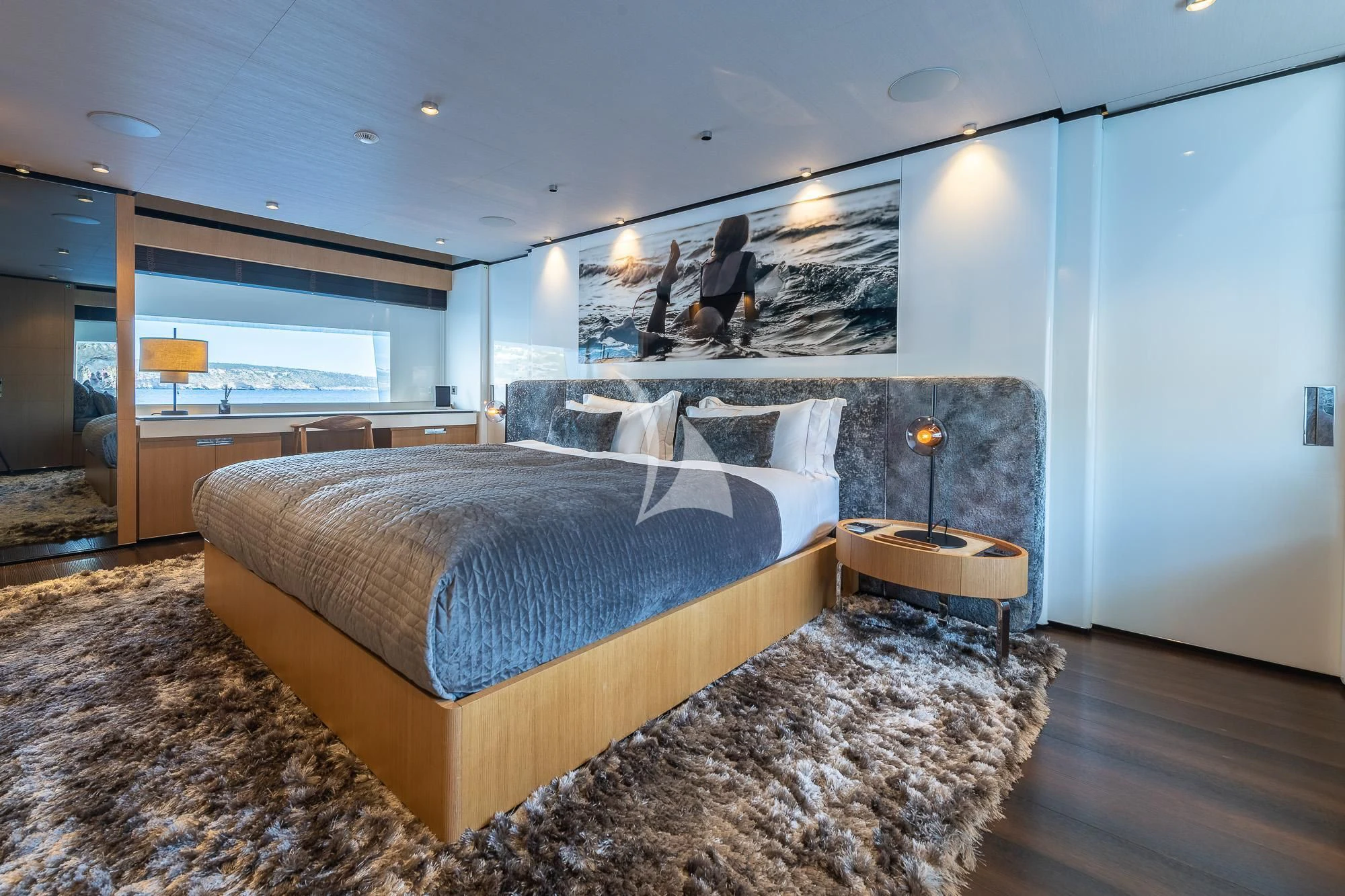 a bedroom with a large bed aboard MR. T Yacht for Charter