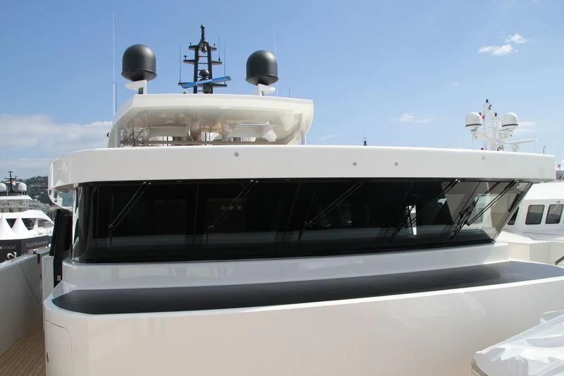 a white yacht with a large white domed roof aboard MR. T Yacht for Charter