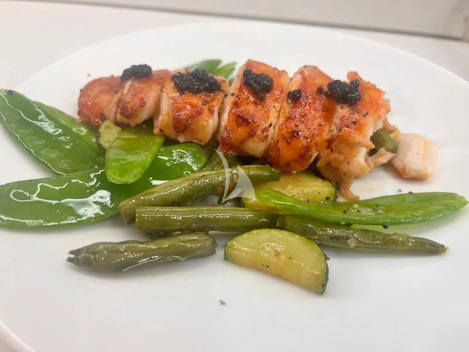 a plate of food aboard MR. T Yacht for Charter