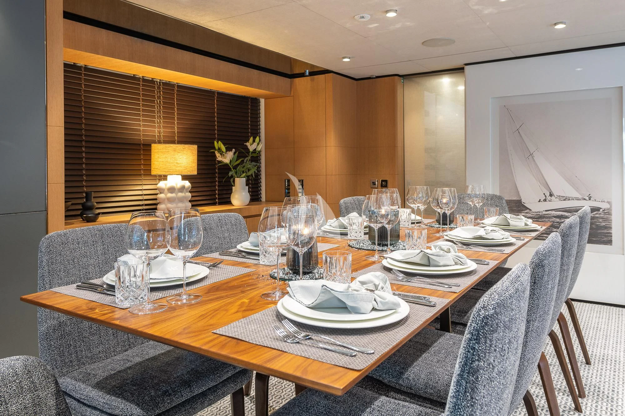 a table with plates and glasses aboard MR. T Yacht for Charter