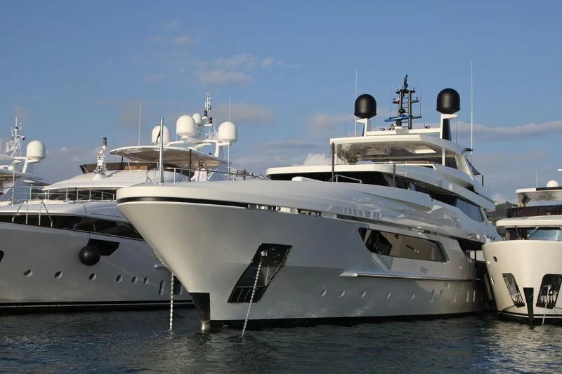 a group of white yachts aboard MR. T Yacht for Charter
