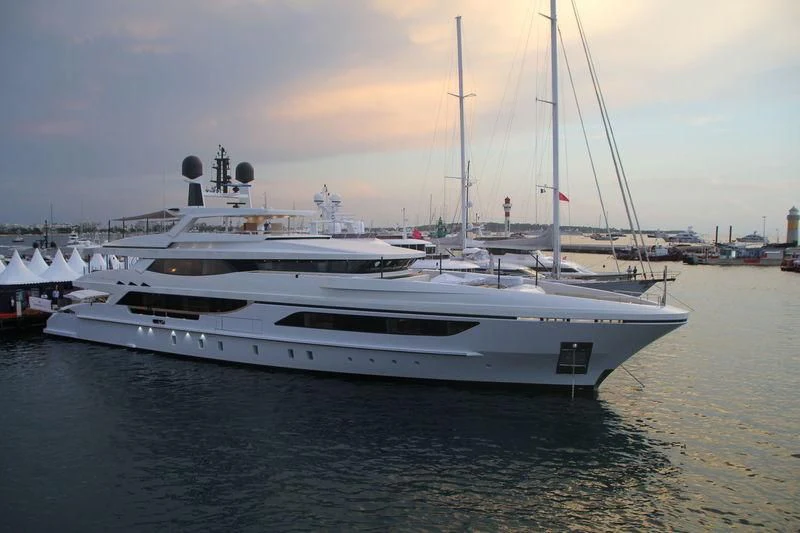 a couple of white yachts in the water aboard MR. T Yacht for Charter