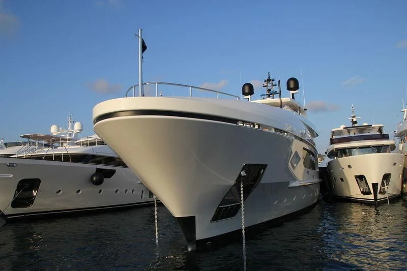 a few white yachts in the water aboard MR. T Yacht for Charter