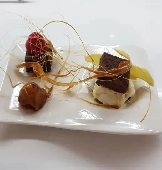 a plate of dessert aboard MR. T Yacht for Charter