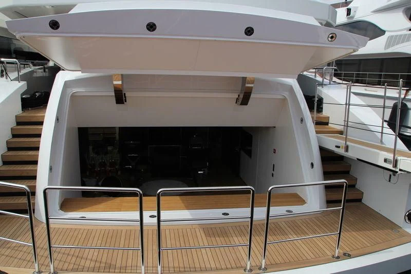 a white rectangular object with a black circle on it aboard MR. T Yacht for Charter