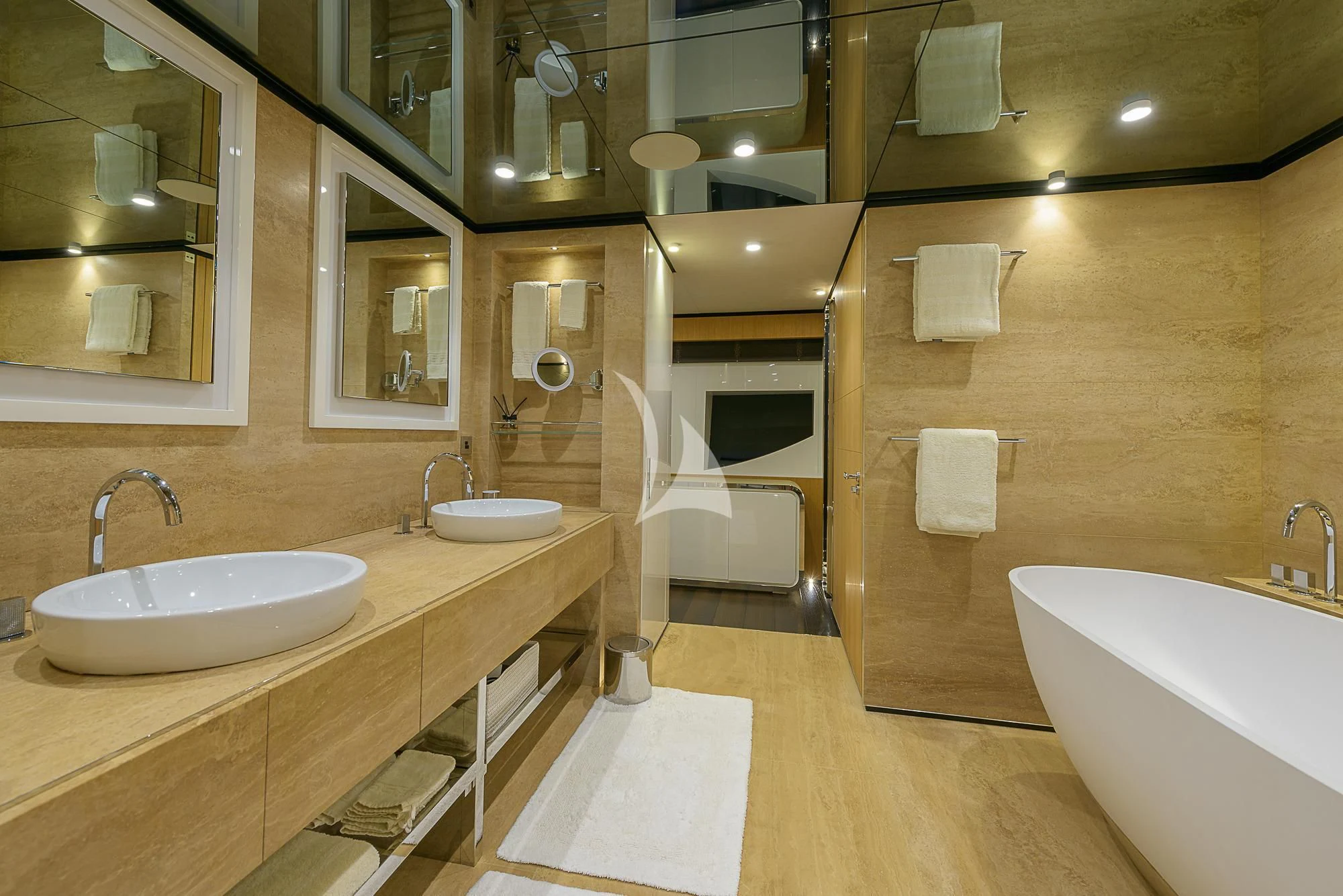 a bathroom with a tub sink and a sink aboard MR. T Yacht for Charter