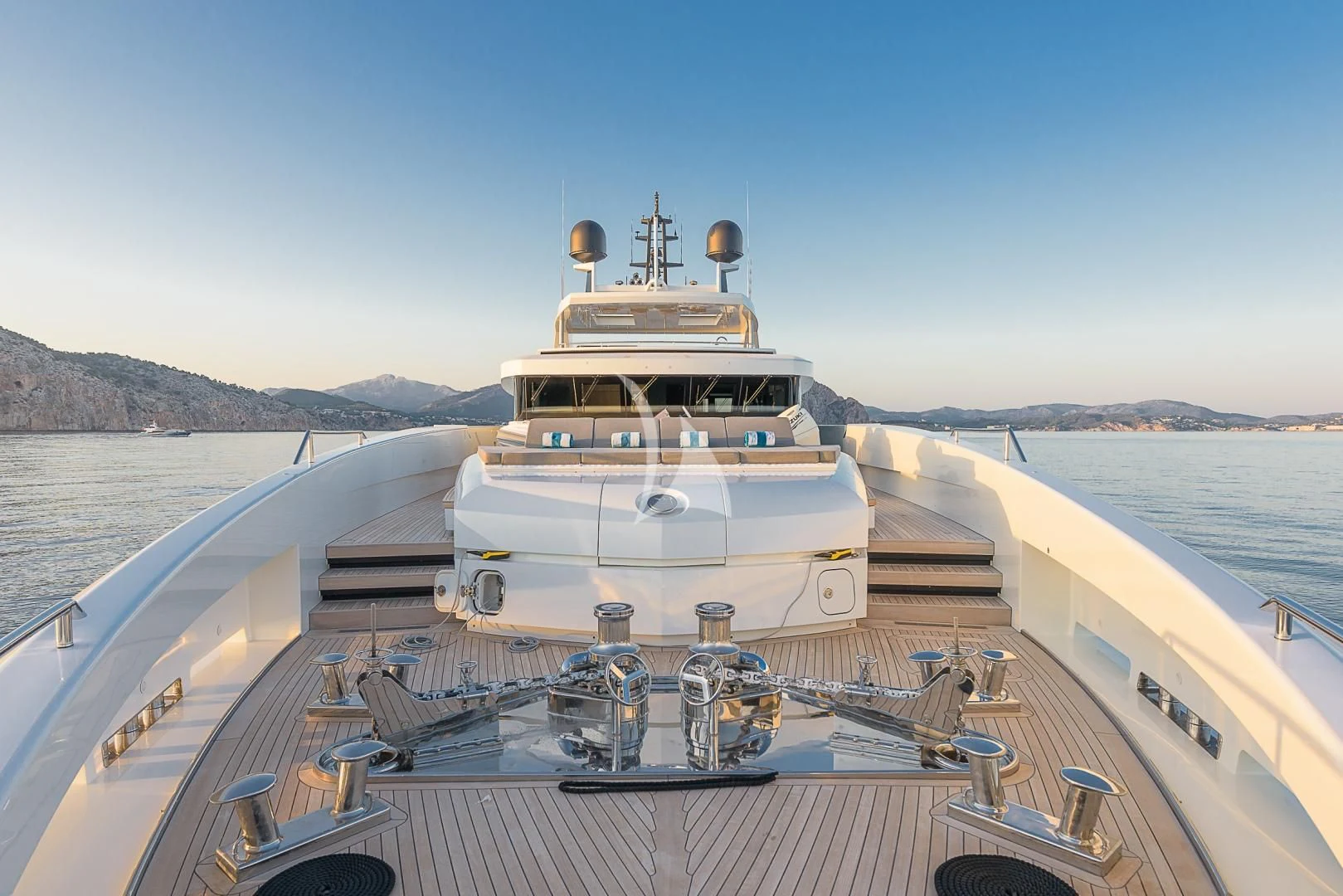 a large ship on a body of water aboard MR. T Yacht for Charter