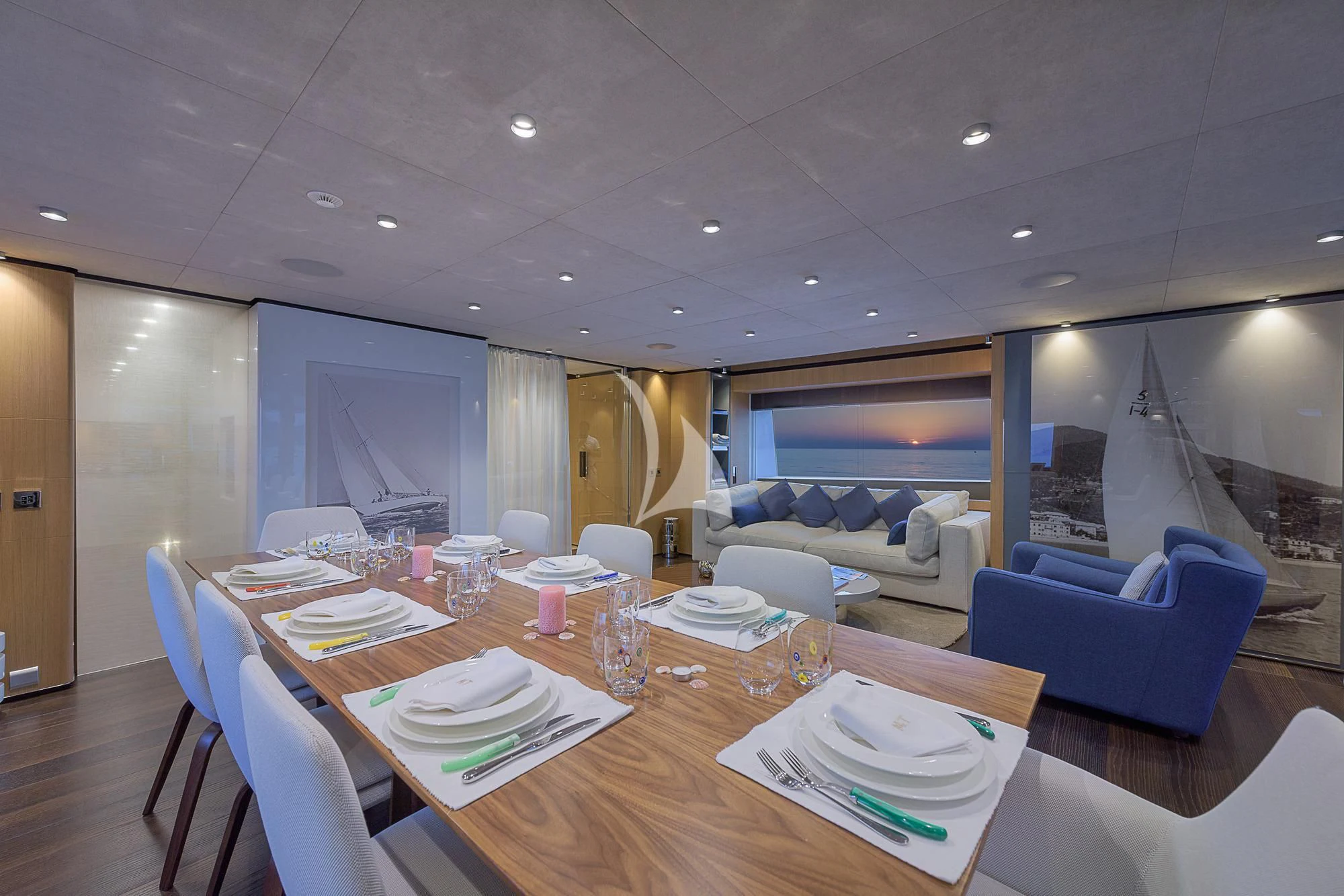 a dining room with a large table aboard MR. T Yacht for Charter