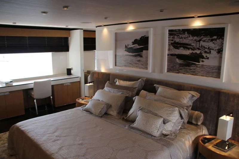 a large bed in a hotel room aboard MR. T Yacht for Charter