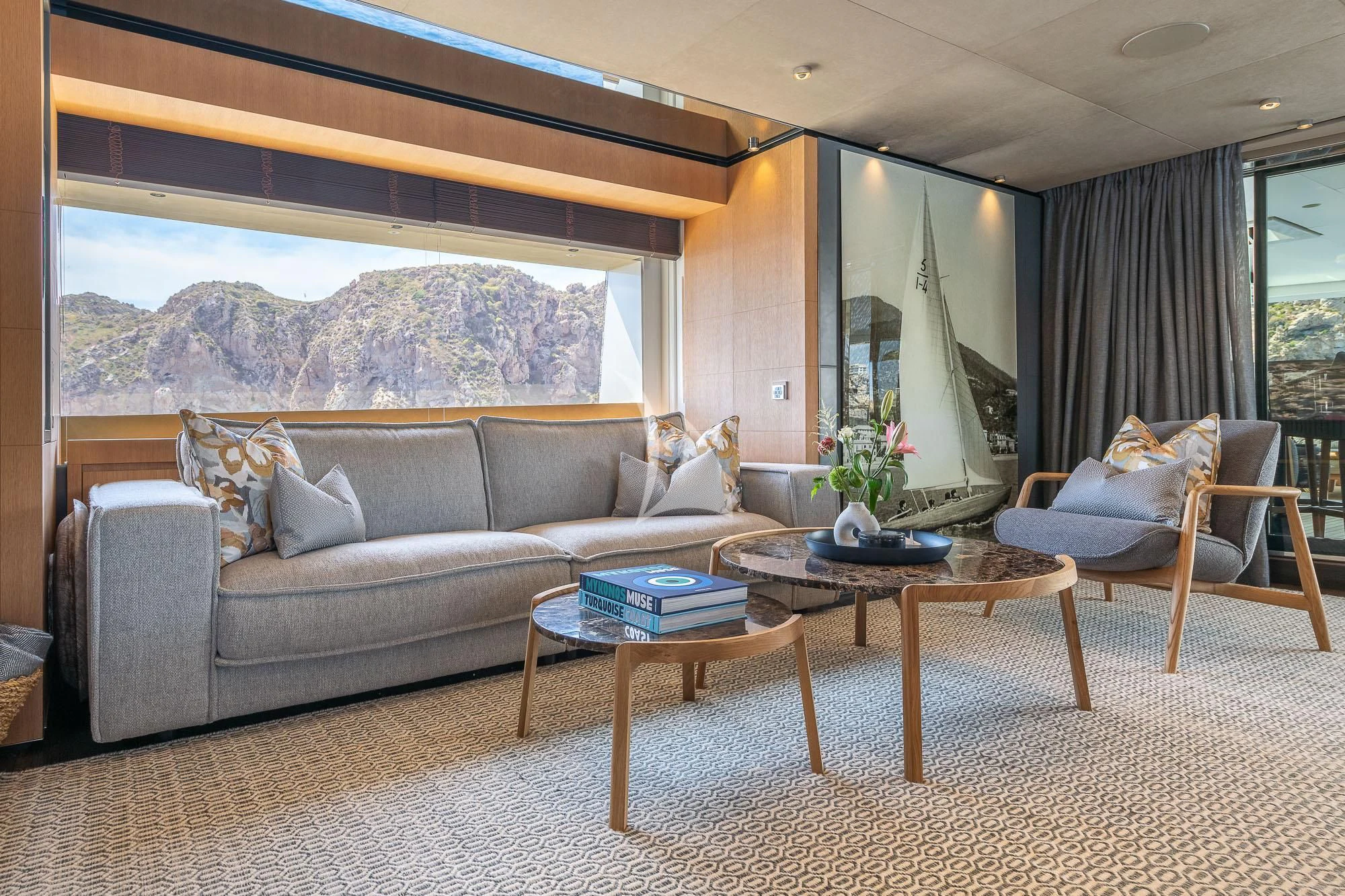a living room with a large window aboard MR. T Yacht for Charter