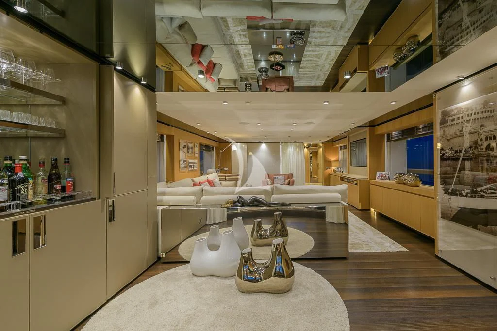 a room with a couch and a table aboard MR. T Yacht for Charter