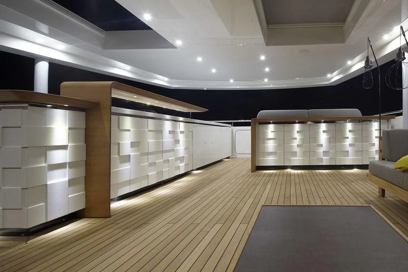 a room with a large wooden closet aboard MR. T Yacht for Charter