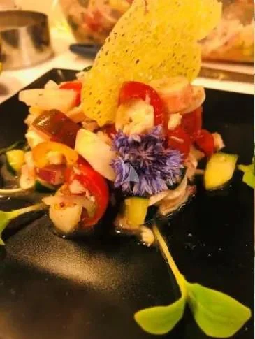 a sushi roll with chopsticks and a flower aboard MR. T Yacht for Charter