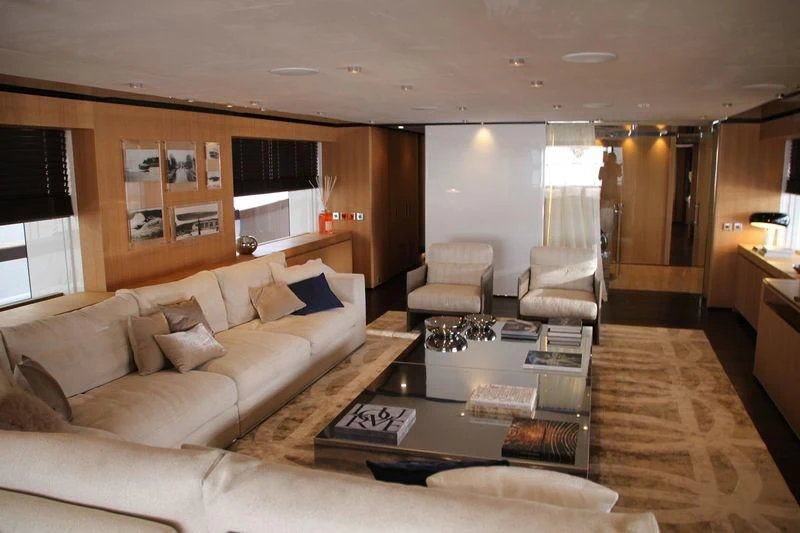 a living room with a couch and a coffee table aboard MR. T Yacht for Charter