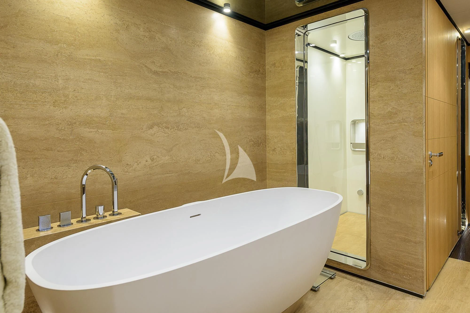 a bathroom with a bathtub and sink aboard MR. T Yacht for Charter