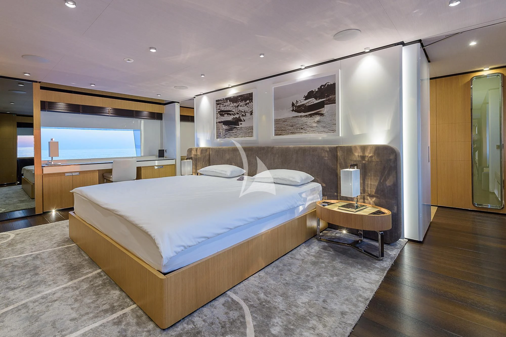 a large bedroom with a large bed aboard MR. T Yacht for Charter