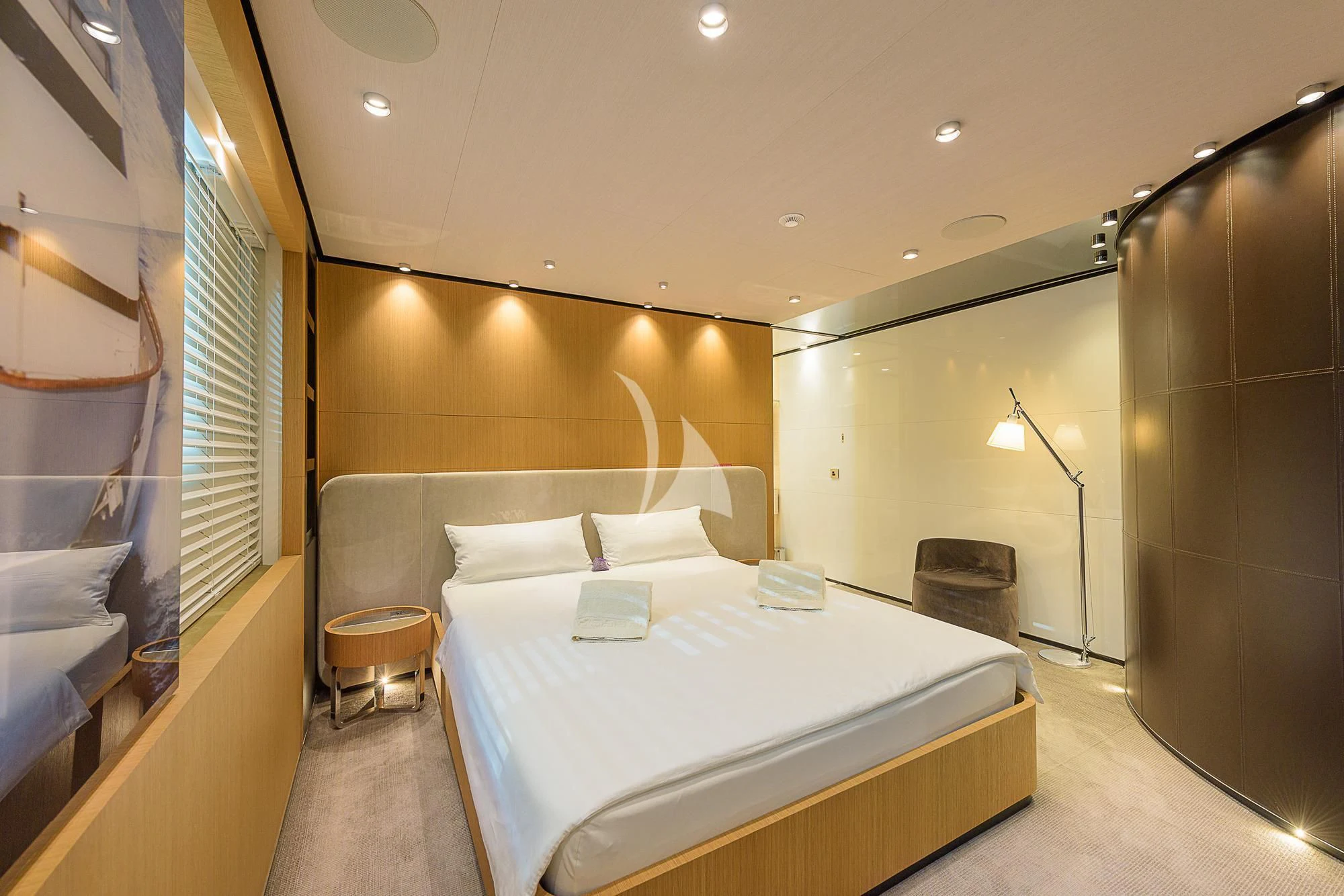 a bed in a room aboard MR. T Yacht for Charter