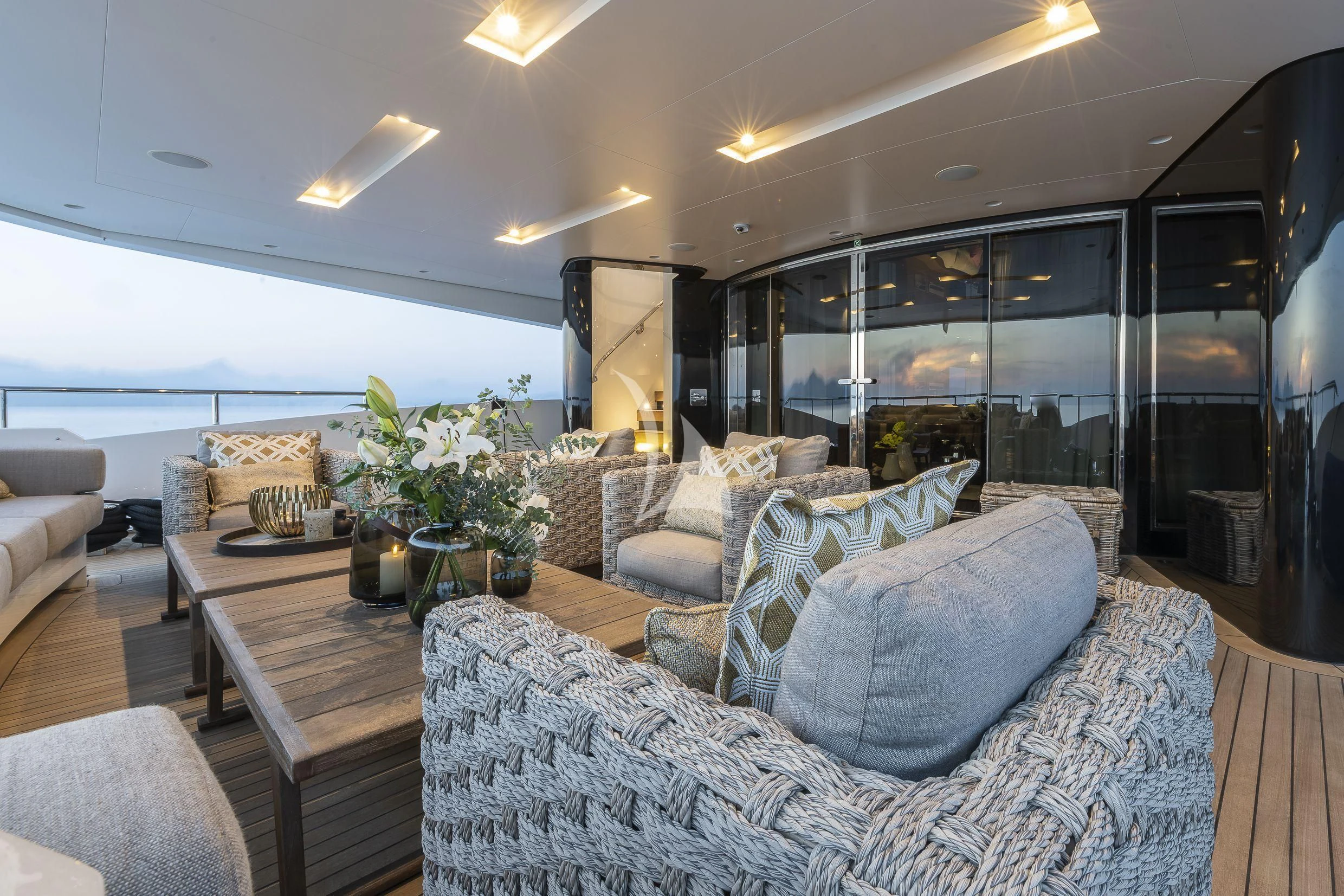 a living room with a large glass window aboard MR. T Yacht for Charter