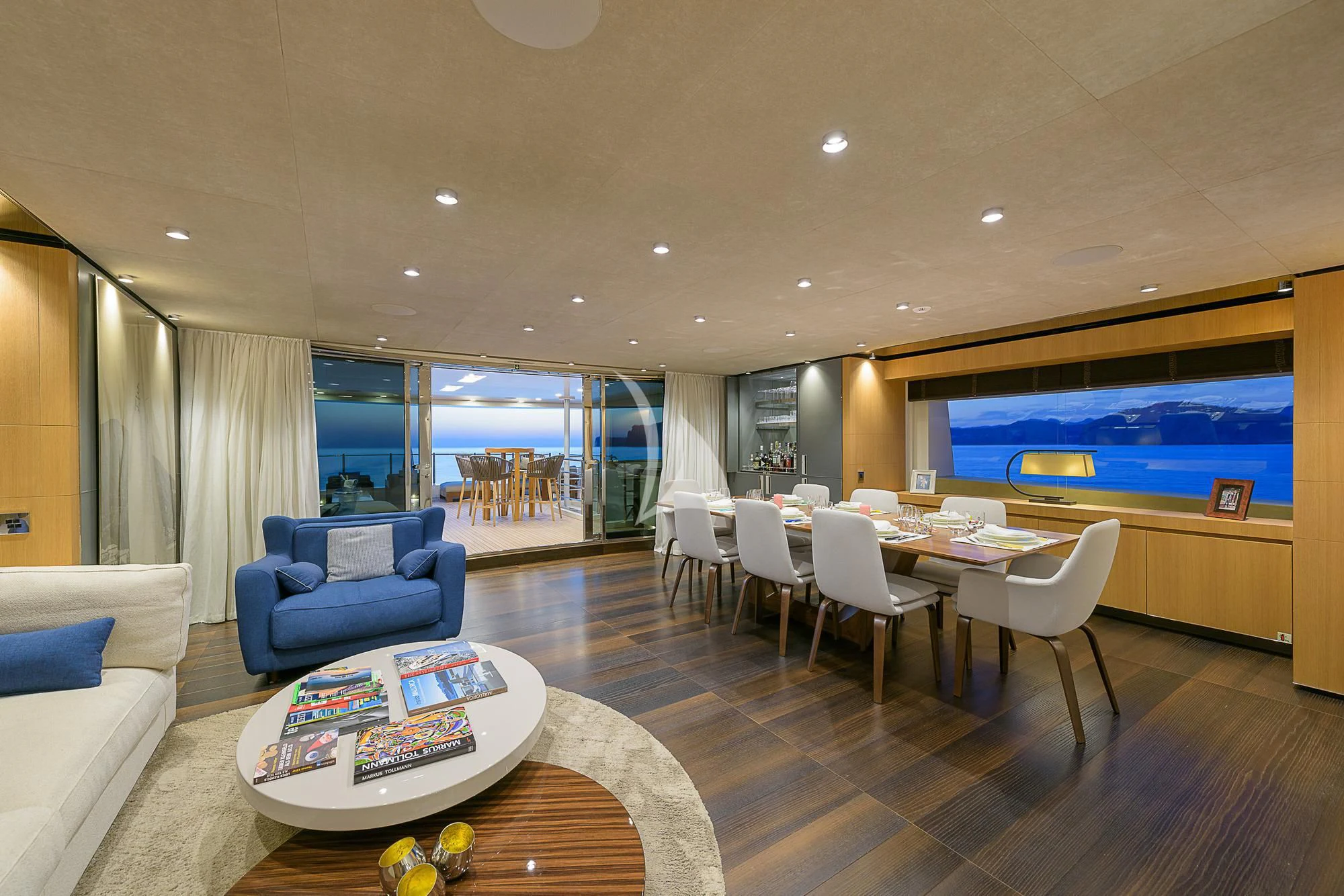a living room with a large screen aboard MR. T Yacht for Charter
