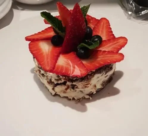 a pastry with fruit on top aboard MR. T Yacht for Charter