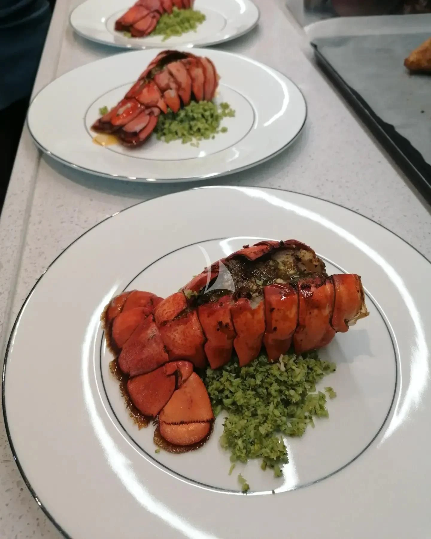 a table with plates of food aboard MR. T Yacht for Charter