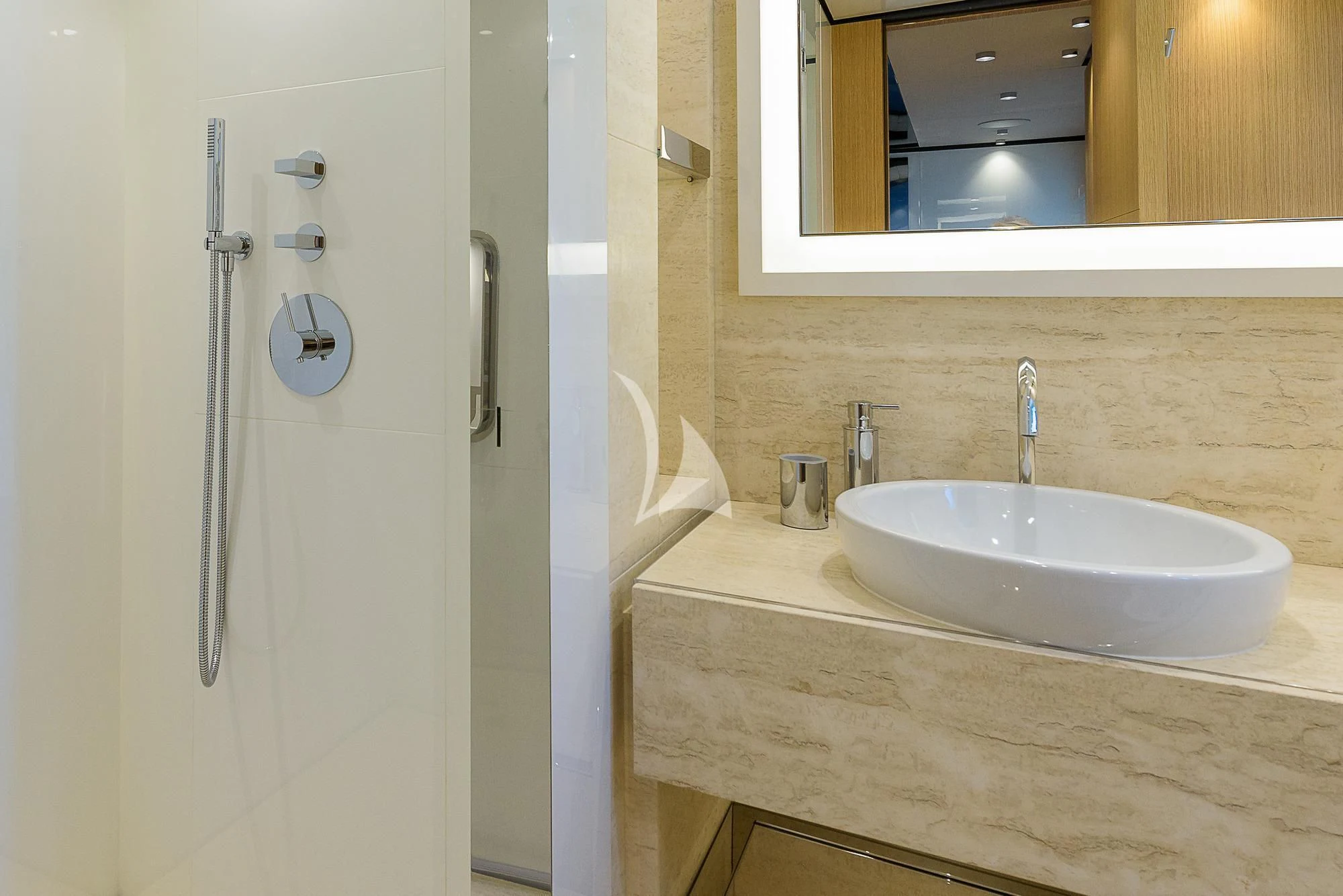 a bathroom with a sink and a mirror aboard MR. T Yacht for Charter