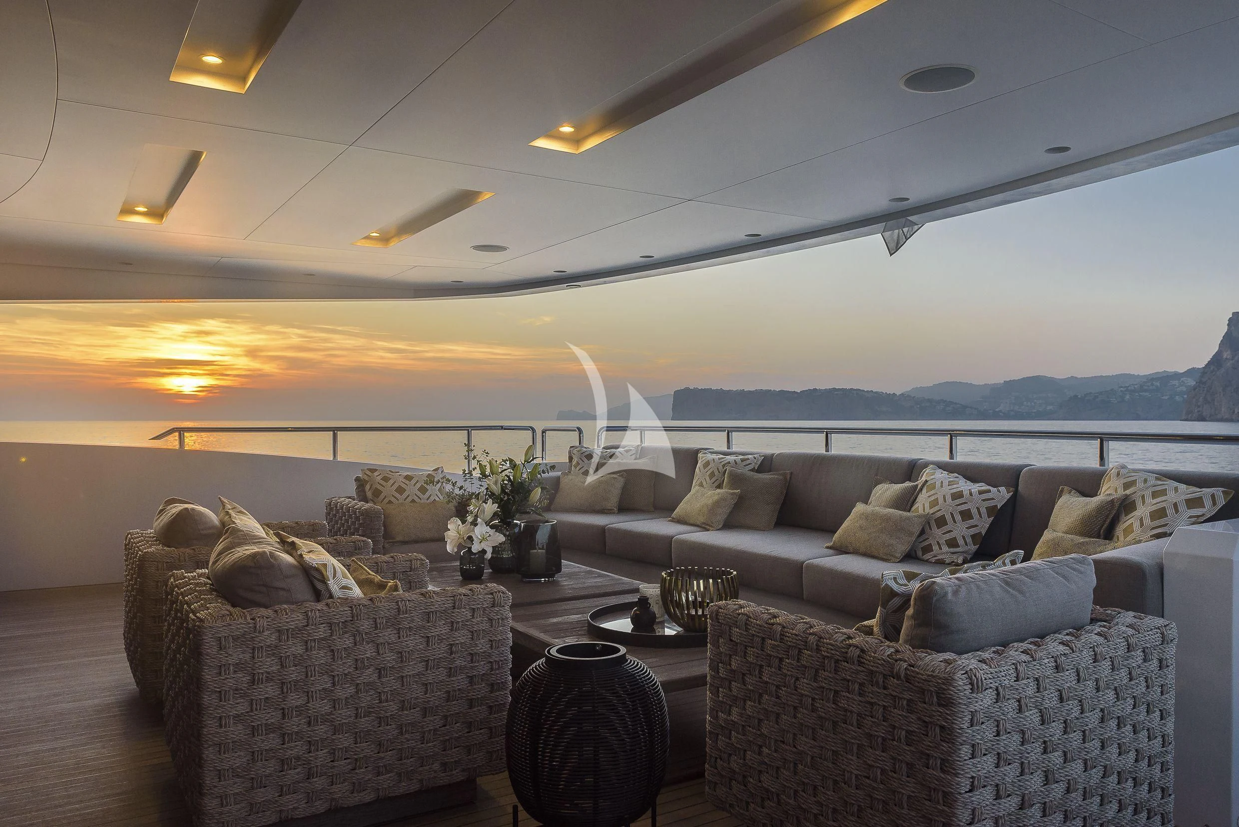 a living room with a large sofa aboard MR. T Yacht for Charter
