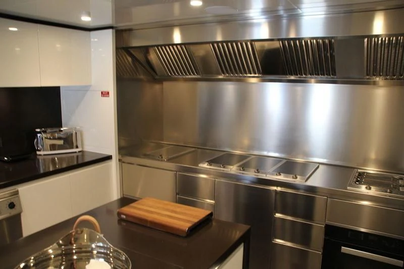 a kitchen with stainless steel appliances aboard MR. T Yacht for Charter