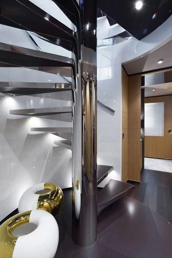 a black and silver staircase aboard MR. T Yacht for Charter
