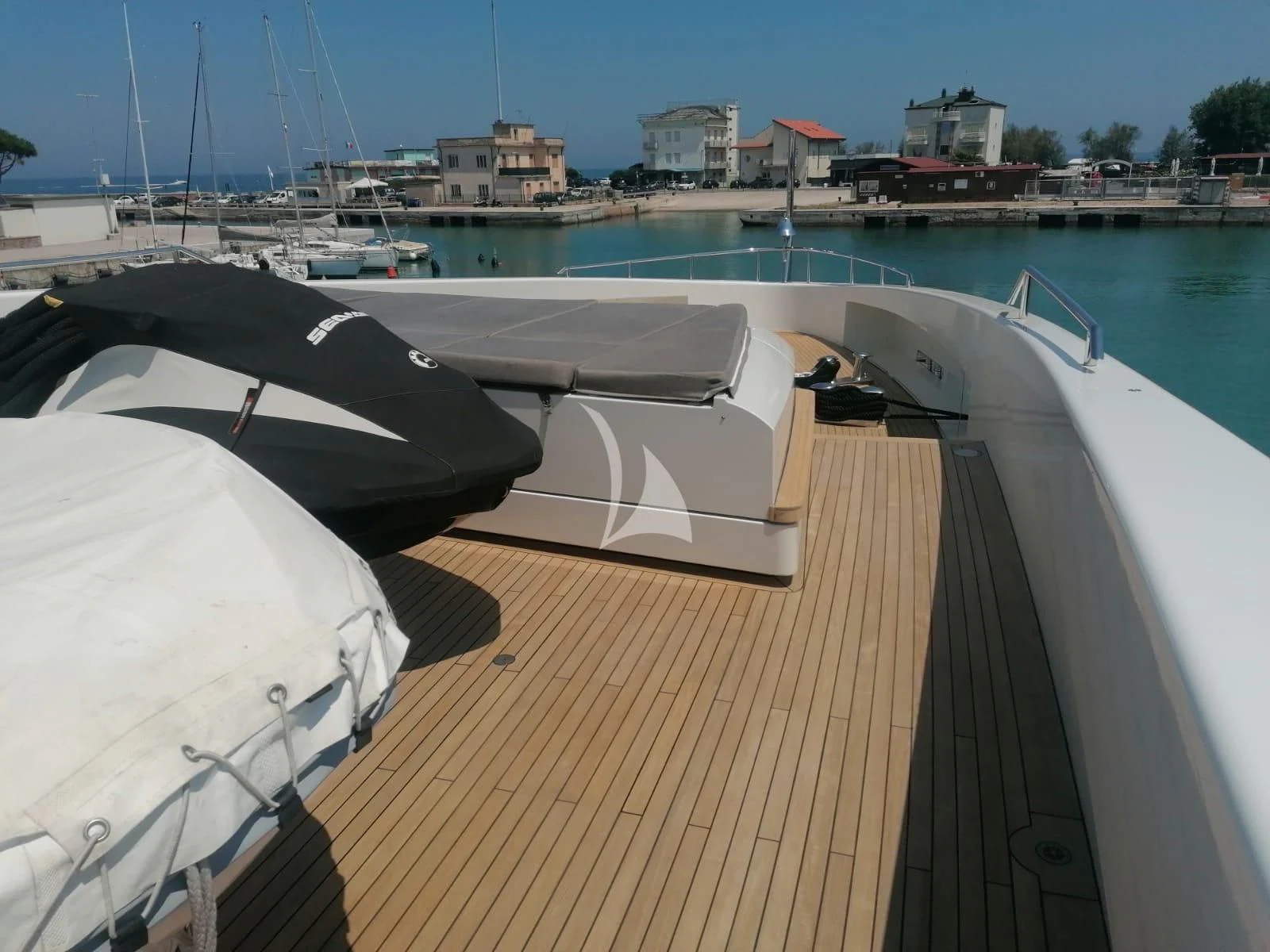 a deck with boats on it aboard MR. T Yacht for Charter