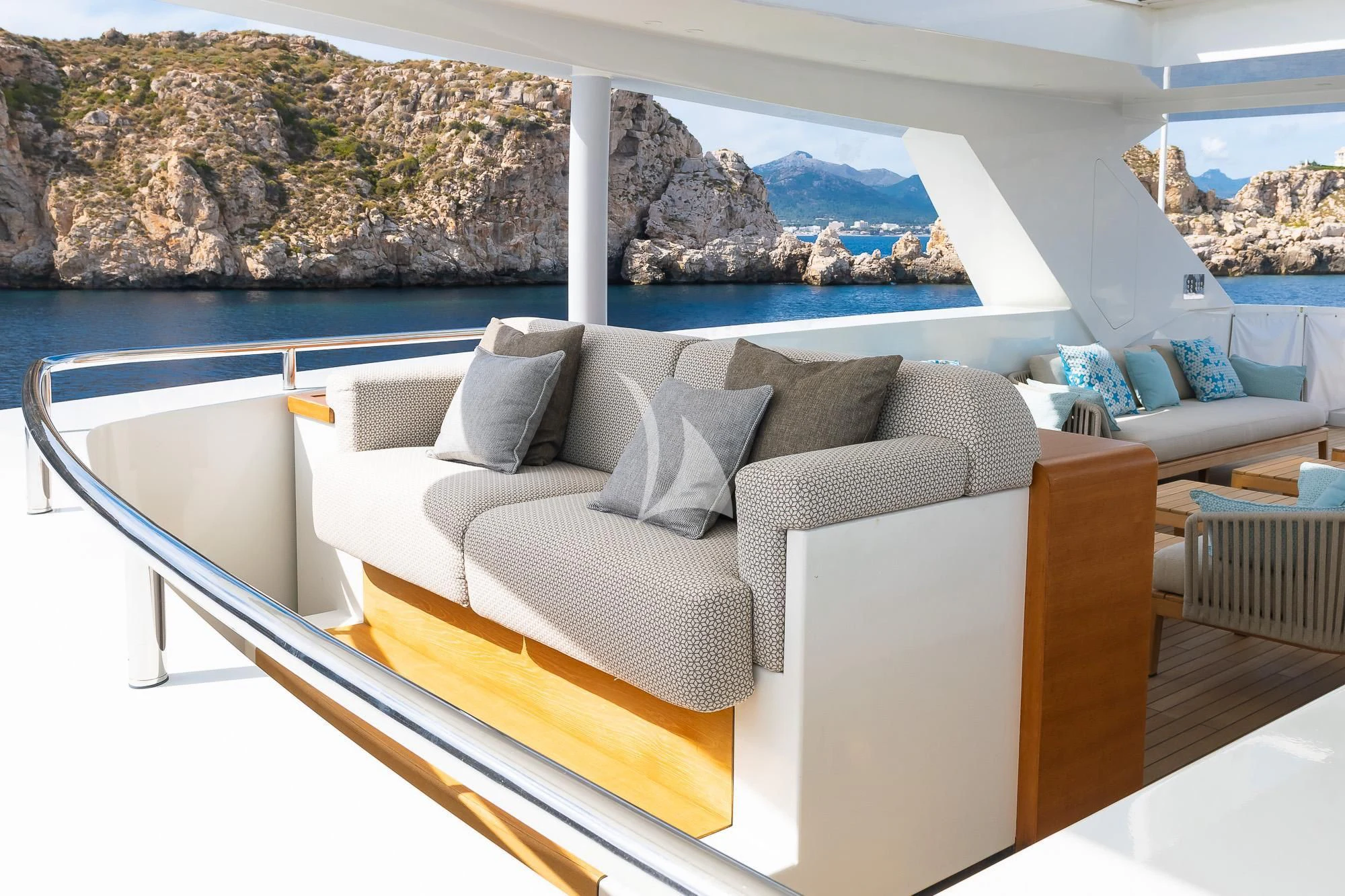a room with a couch and a pool aboard MR. T Yacht for Charter