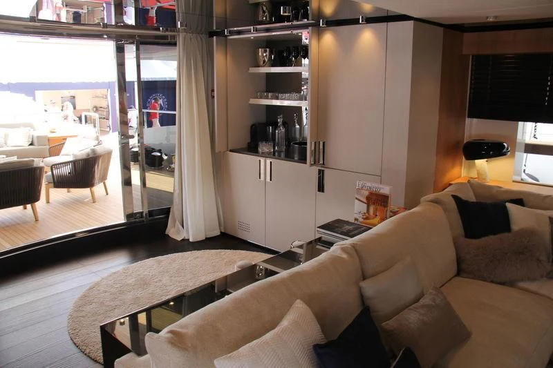 a living room with a couch and a table aboard MR. T Yacht for Charter