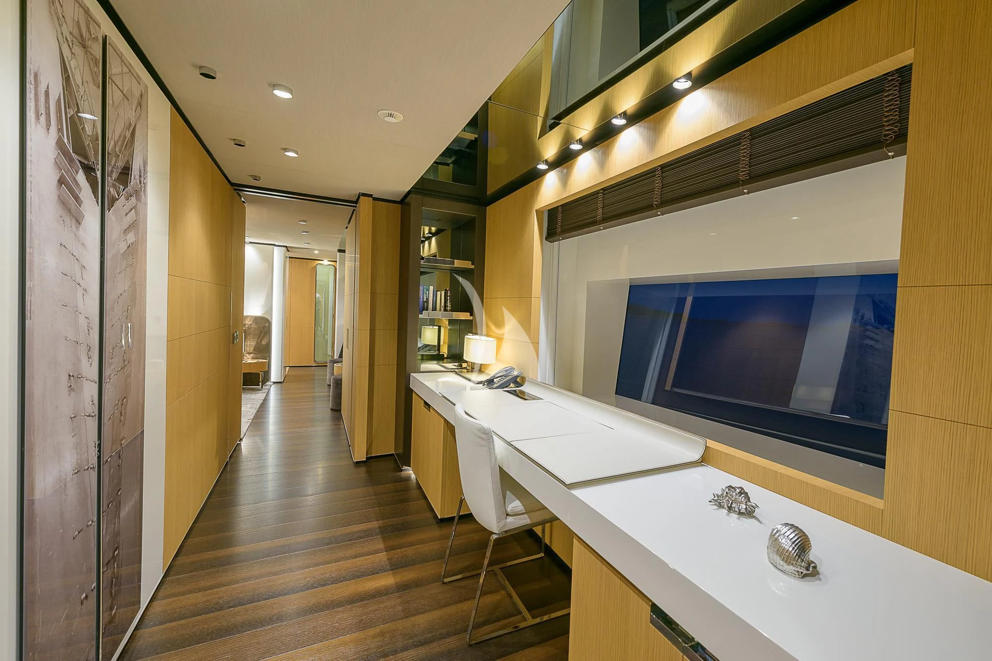a room with a long counter and a television on the wall aboard MR. T Yacht for Charter