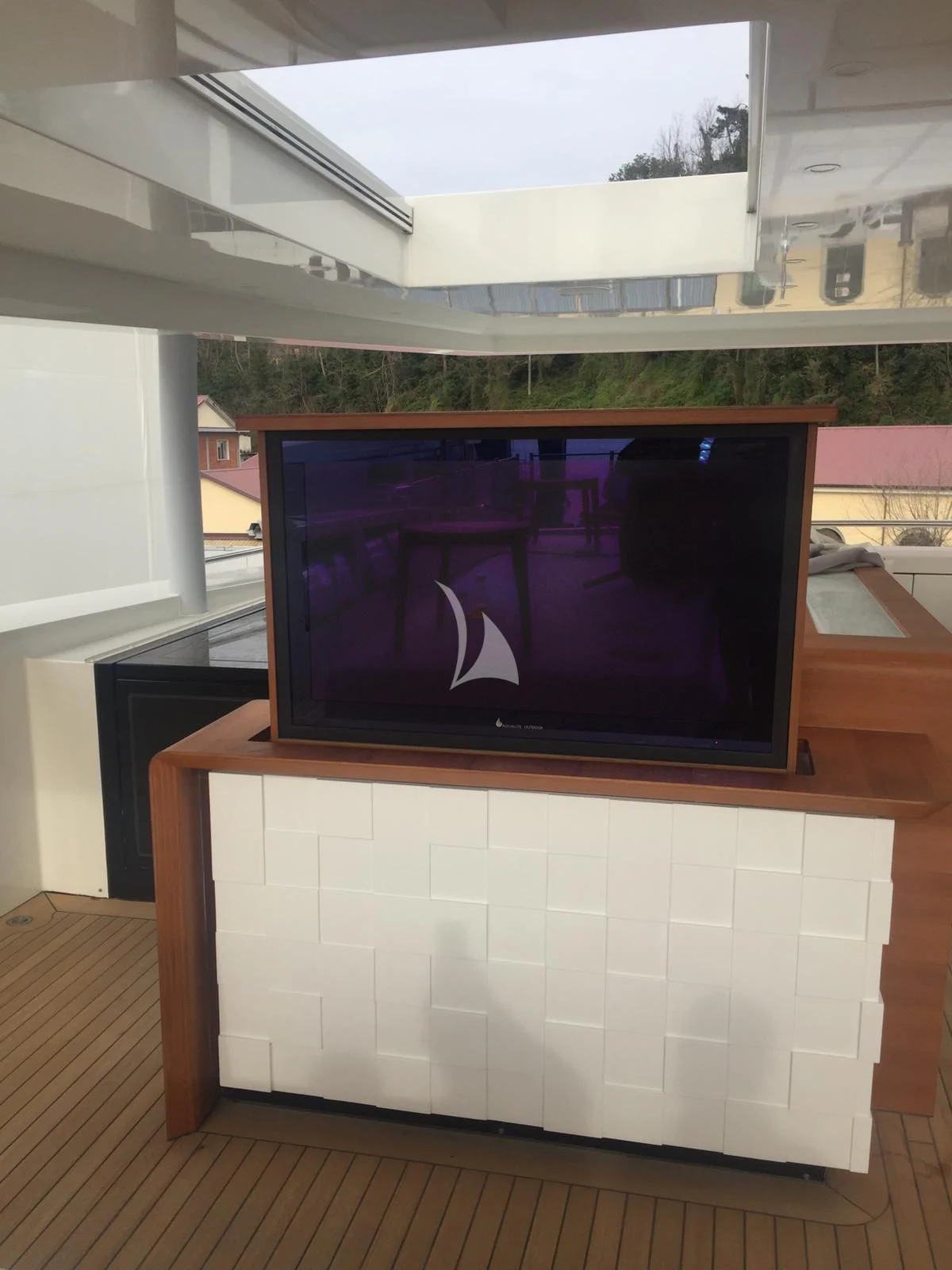 a tv on a table aboard MR. T Yacht for Charter